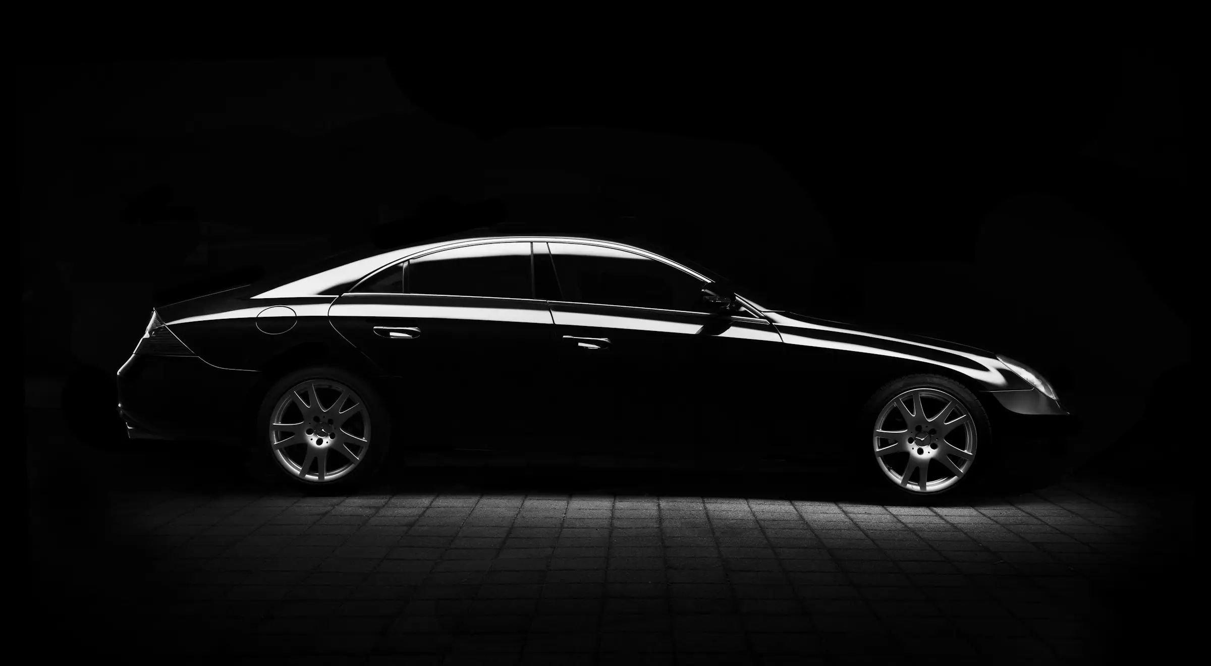 black car in a dark showroom